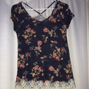 Navy blue shirt with flower designs and an X back